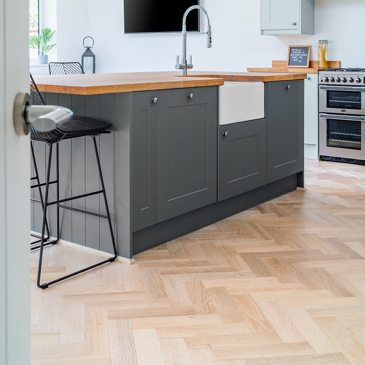 Bright British kitchen and dining area with practical cushioned vinyl flooring
